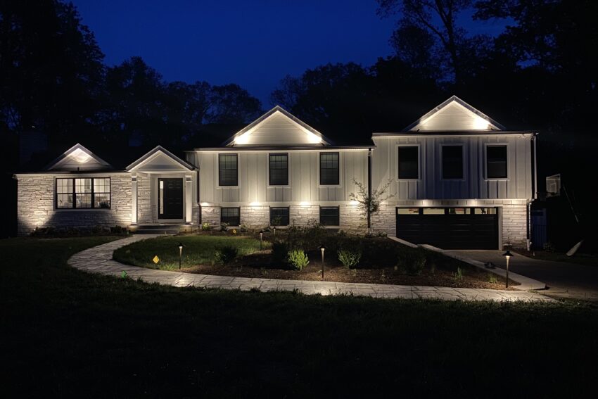 Landscape lighting highlighting a home and garden